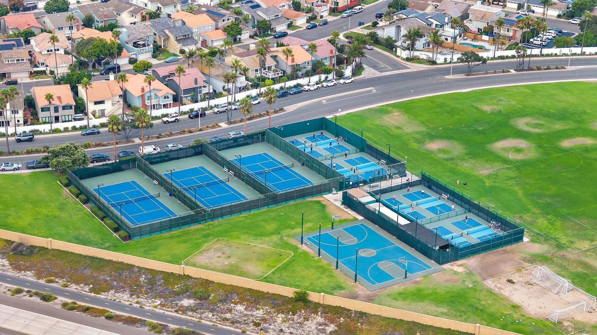 35 Buccaneer Way Coronado, CA 92118 - Photo 26 of 31 a view of a tennis ground with a large tree
