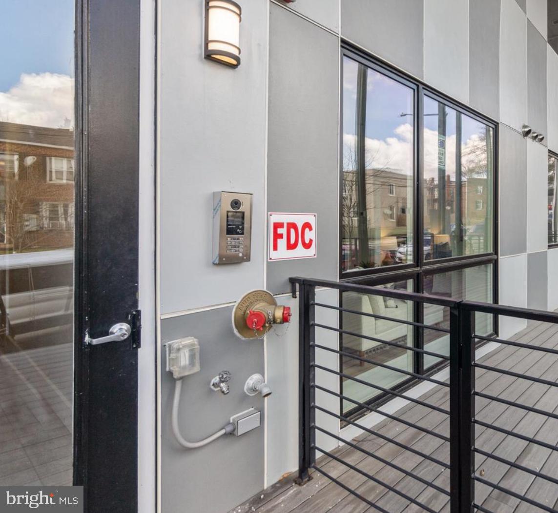820 18th Street Northeast, Unit 102 Washington, DC 20002 - Photo 6 of 17 view of a hallway with a glass door and shower
