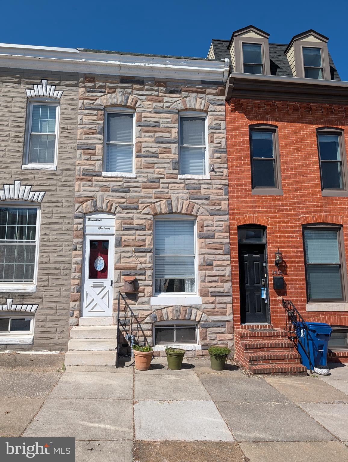1416 Jackson Street Baltimore, MD 21230 - Photo 1 of 7 a front view of a house with stairs