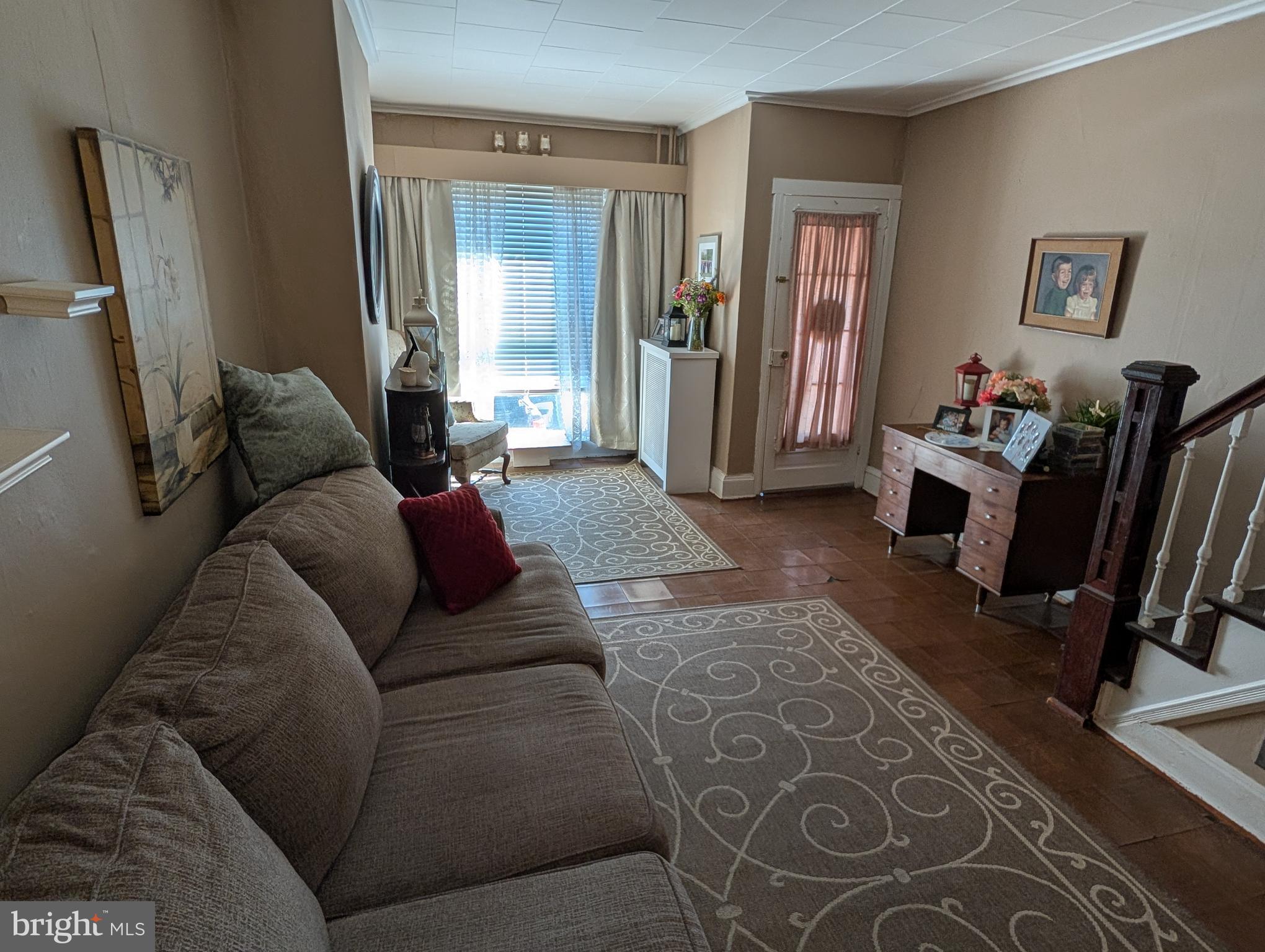 1416 Jackson Street Baltimore, MD 21230 - Photo 2 of 7 a living room with furniture and a flat screen tv