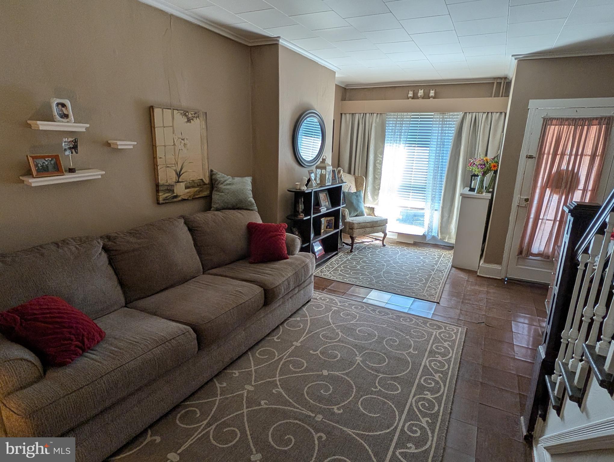 1416 Jackson Street Baltimore, MD 21230 - Photo 3 of 7 a living room with furniture and wooden floor