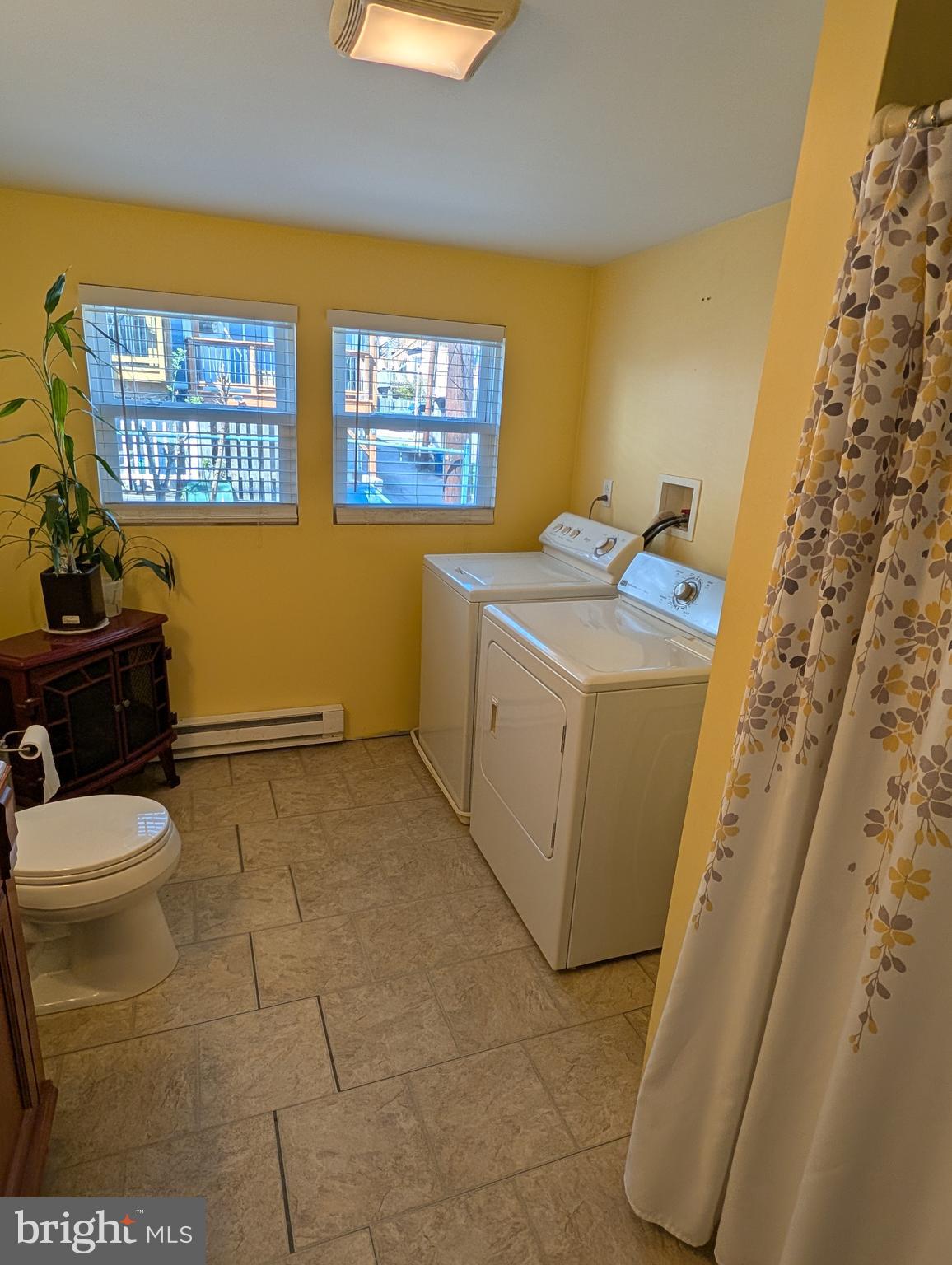 1416 Jackson Street Baltimore, MD 21230 - Photo 6 of 7 a bathroom with a sink a toilet and a shower