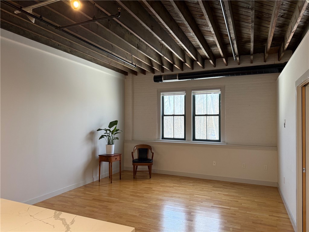 12 Canal Street, Unit 205 Westerly, RI 02891 - Photo 2 of 15 Exposed wood ceiling at 12 Canal Street #205, Westerly RI 02891