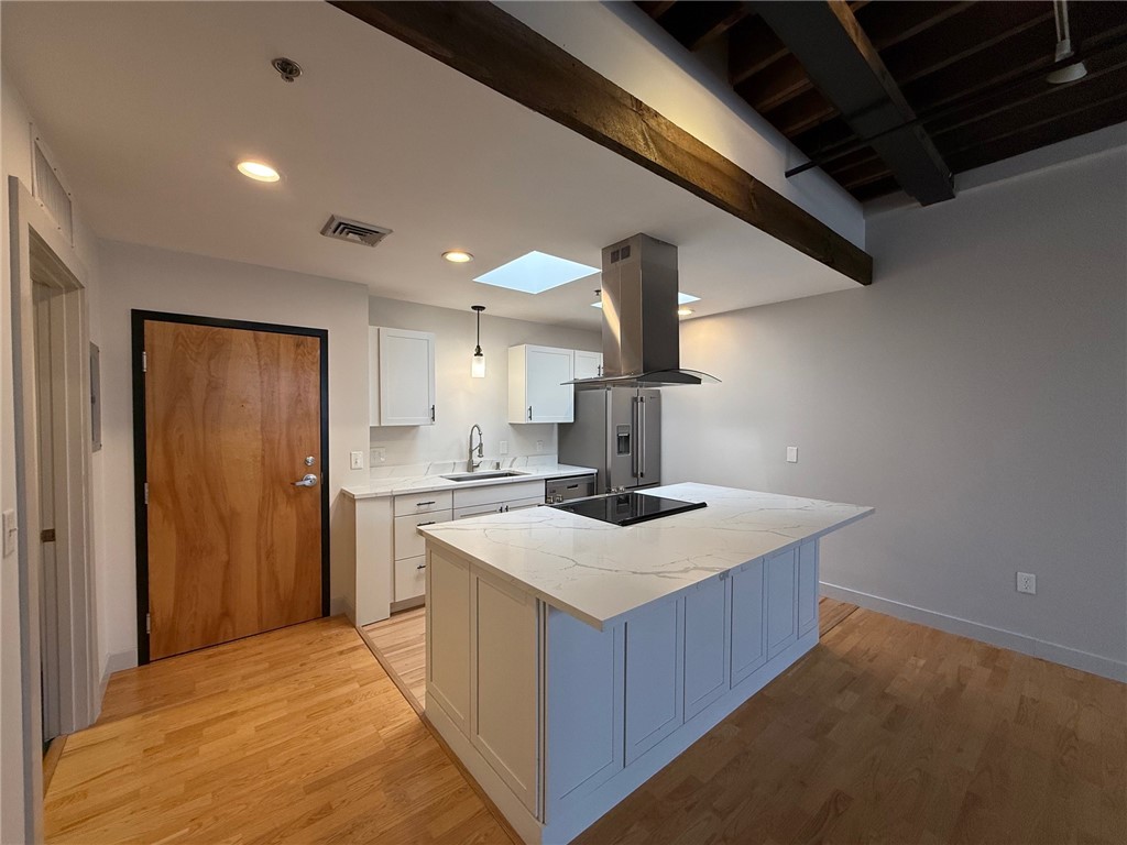 12 Canal Street, Unit 205 Westerly, RI 02891 - Photo 5 of 15 Stone countertops and stainless appliances at 12 Canal Street #205, Westerly RI 02891