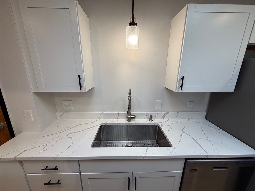 12 Canal Street, Unit 205 Westerly, RI 02891 - Photo 7 of 15 Big, deep kitchen sink and garbage disposal in the modern sleek kitchen. 12 Canal Street #205, Westerly RI 02891