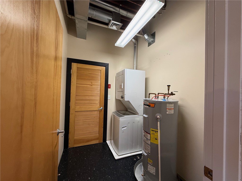 12 Canal Street, Unit 205 Westerly, RI 02891 - Photo 8 of 15 New stackable washer and dryer with storage area in the laundry room. 12 Canal Street #205, Westerly RI 02891