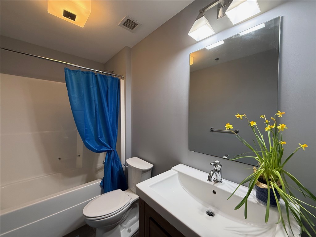 12 Canal Street, Unit 205 Westerly, RI 02891 - Photo 9 of 15 Freshly painted in French Silver, the bathroom has a tub/shower combination unit. 12 Canal Street #205, Westerly RI 02891