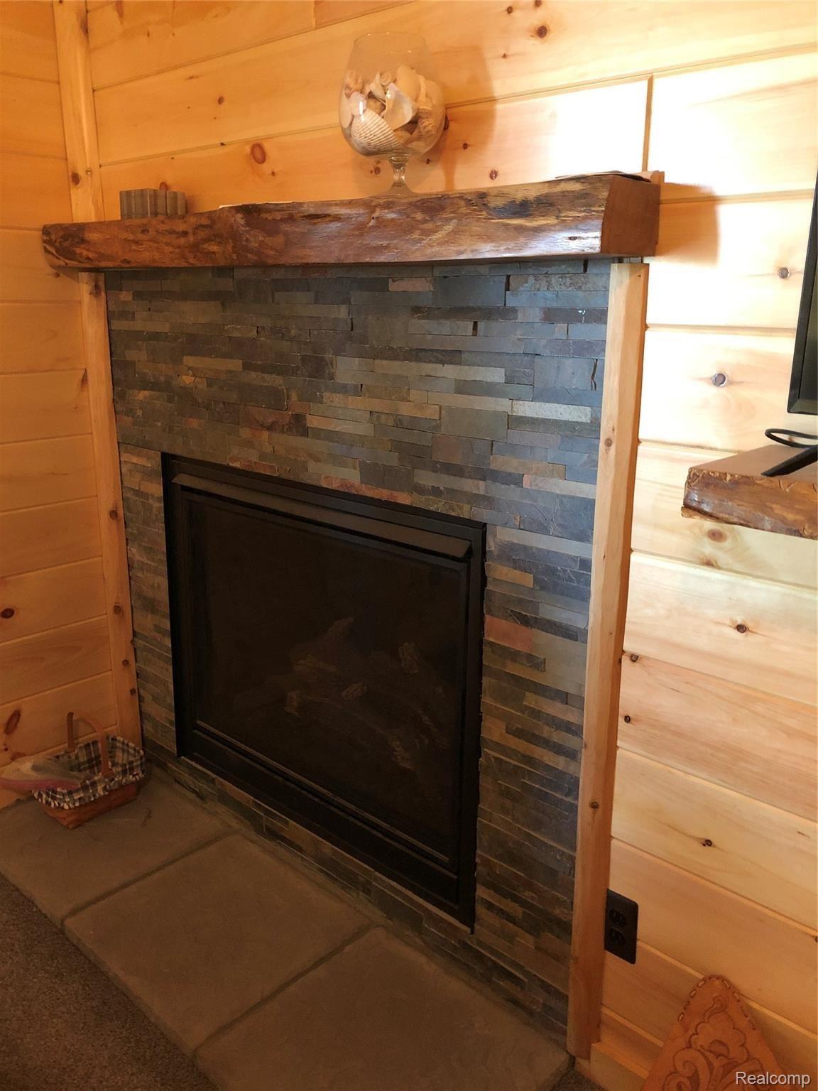 6263 General Squier Road Almont, MI 48003 - Photo 15 of 45 Cozy gas fireplace in master suite