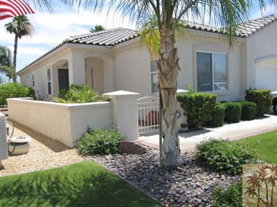 80570 Knightswood Road Indio, CA 92201 - Photo 3 of 14 a front view of a house with garden