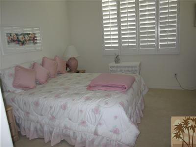 80570 Knightswood Road Indio, CA 92201 - Photo 9 of 14 a bedroom with a bed and a window