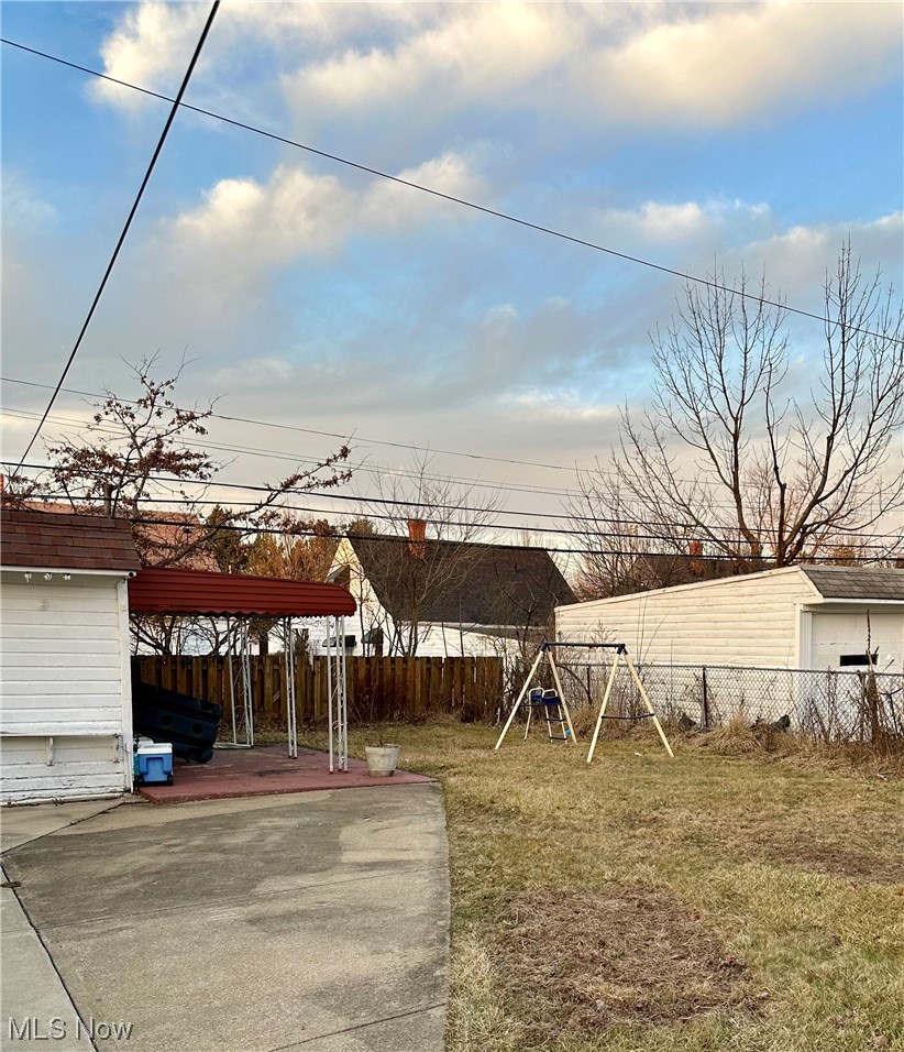 4197 Lambert Road Cleveland, OH 44121 - Photo 13 of 13 View of yard with a carport