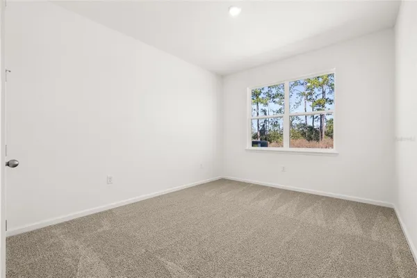an empty room with closet area