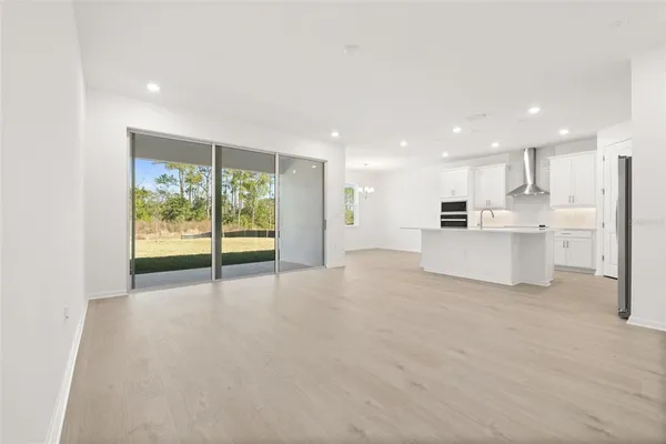 a view of an empty room with a stove top oven
