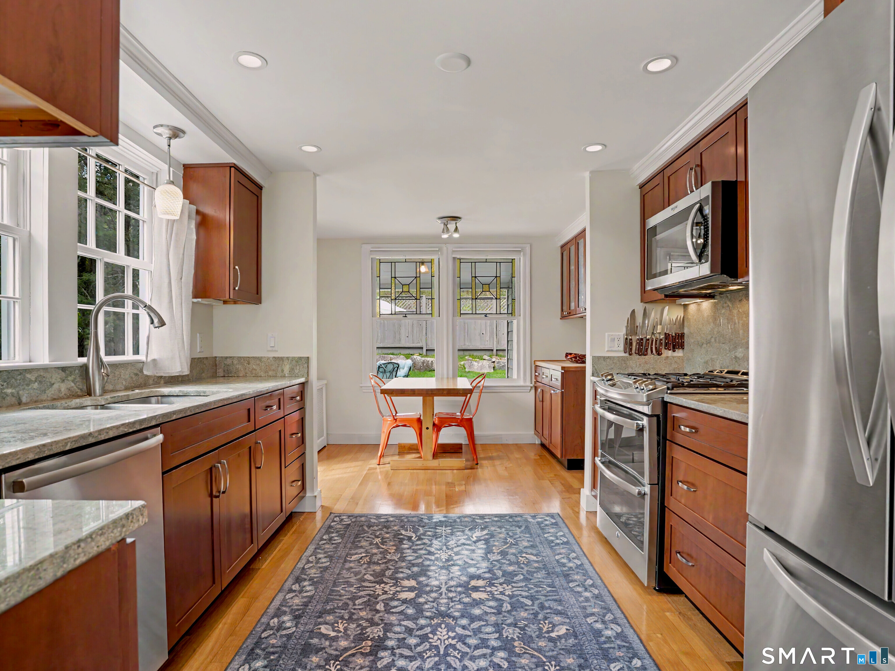 105 Ivy Hill Road Ridgefield, CT 06877 - Photo 11 of 39 The renovated kitchen features cherry cabinets, granite counters and stainless steel applicances. Tons of natural light pours in the windows.