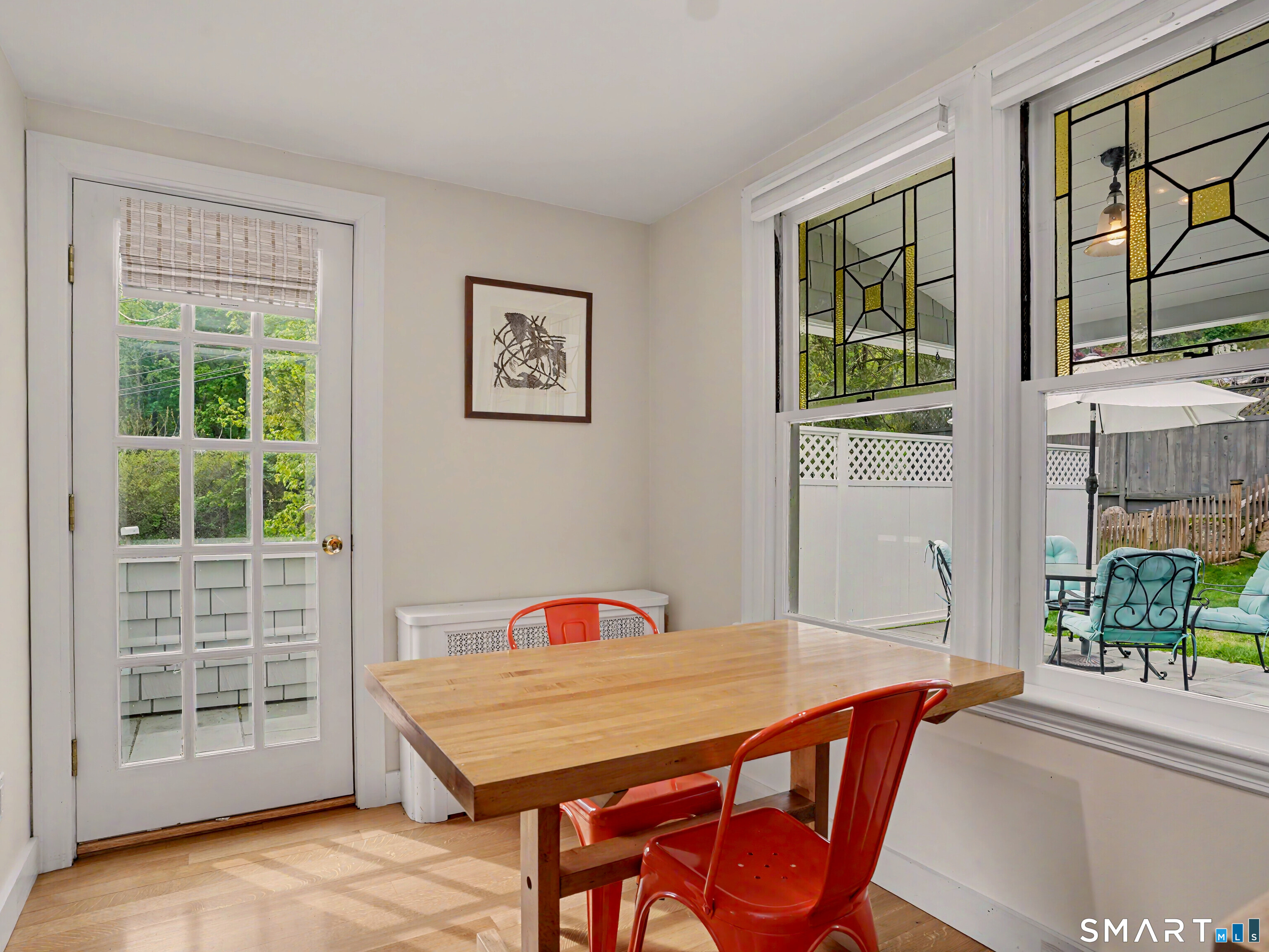 105 Ivy Hill Road Ridgefield, CT 06877 - Photo 14 of 39 The kitchen eating area with stained glass details.