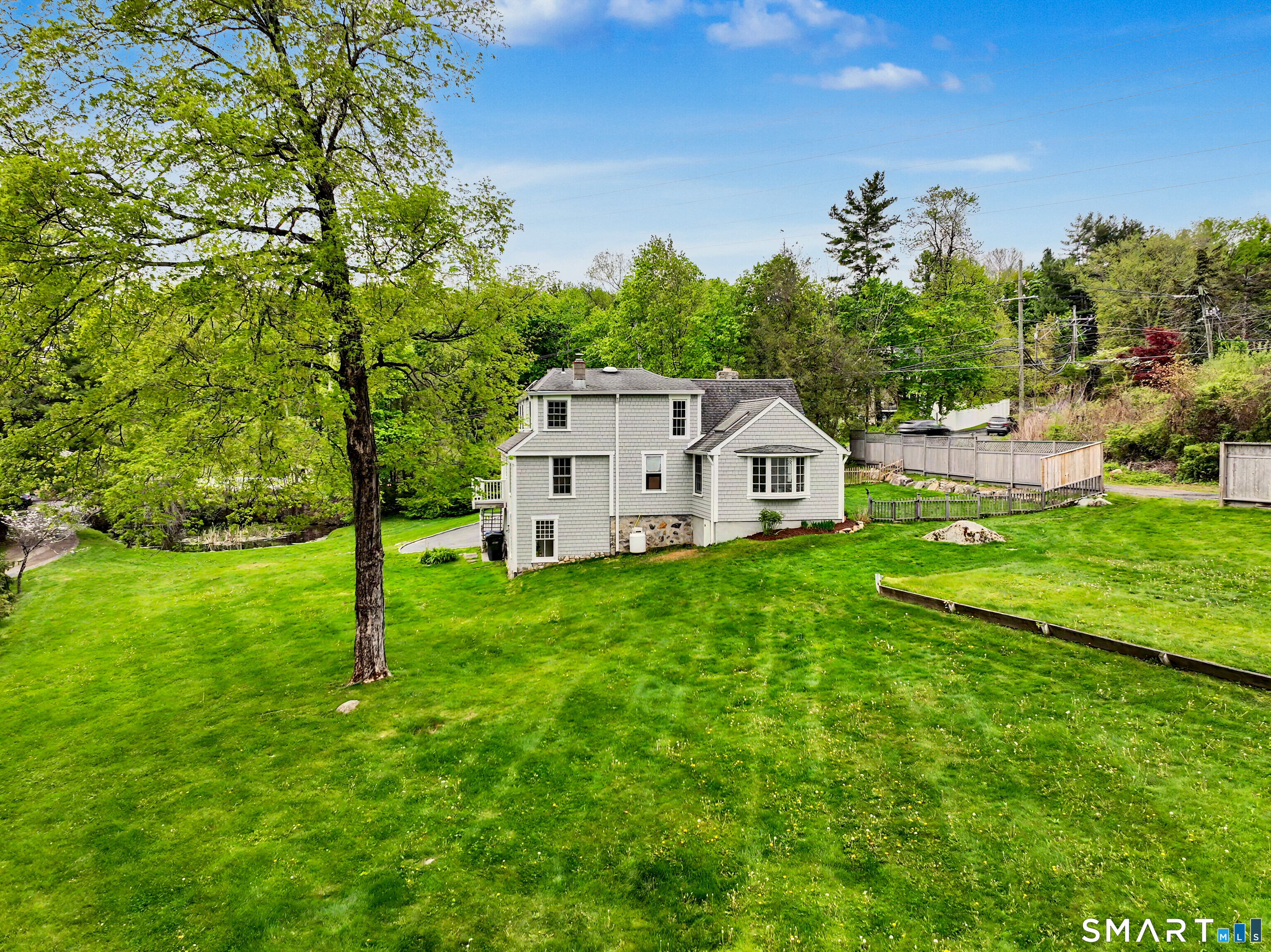 105 Ivy Hill Road Ridgefield, CT 06877 - Photo 3 of 39 The large yard offers privacy and lots of space to play, garden or just enjoy.
