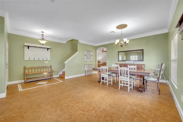 a large kitchen with stainless steel appliances granite countertop a refrigerator and a stove top oven