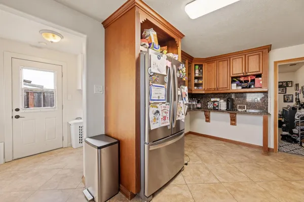 a kitchen with stainless steel appliances granite countertop a stove top oven a sink dishwasher and cabinets with wooden floor