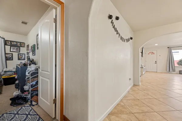 a bedroom with a bed and a dresser