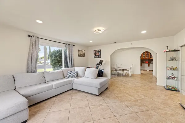 a living room with furniture and large window