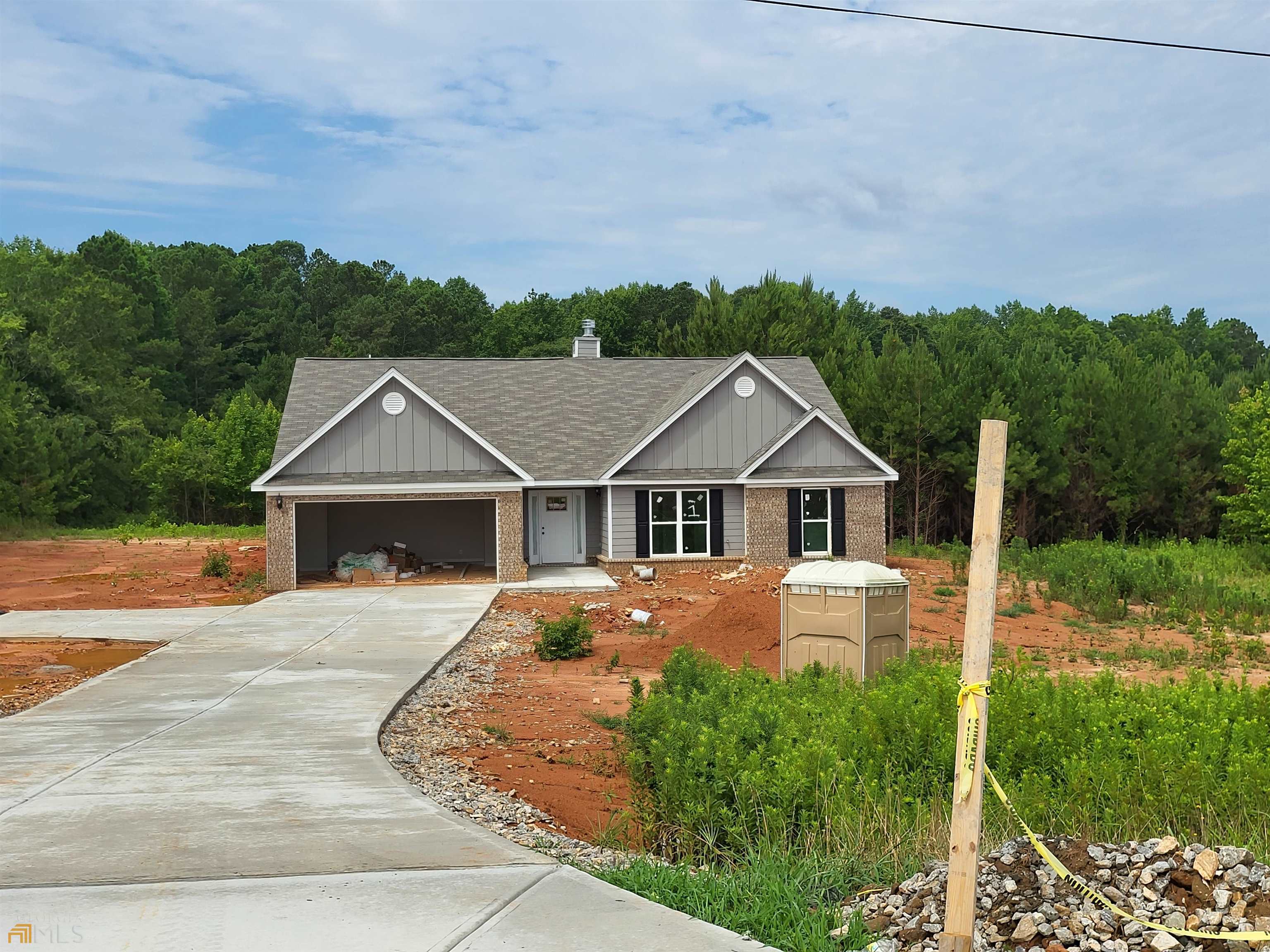 2559 Tommy Dillard Road, Unit 1 Monroe, GA 30656 - Photo 1 of 1 front view of house with a yard