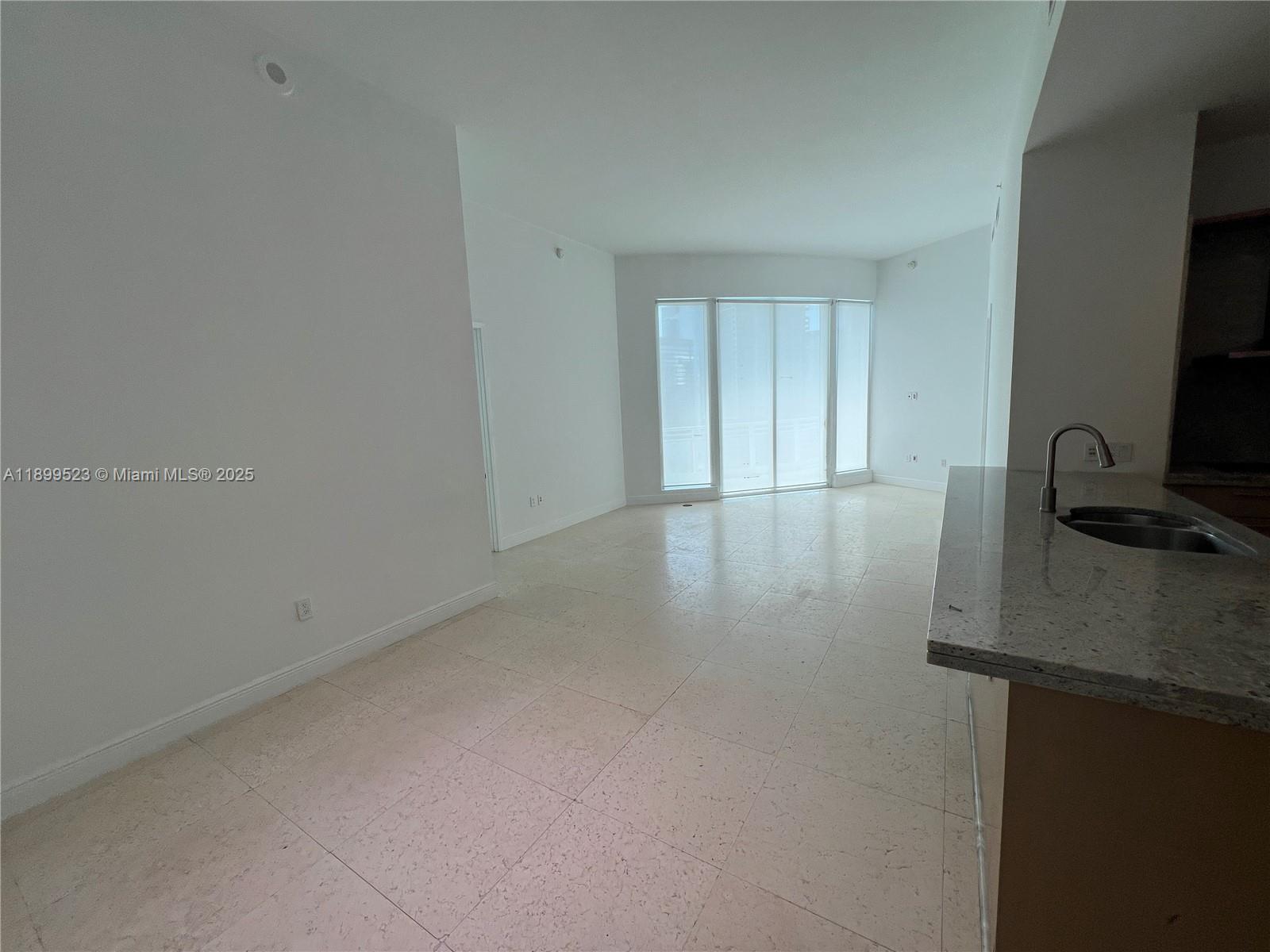 900 Brickell Key Boulevard, Unit 2205 Miami, FL 33131 - Photo 24 of 50 a view of workspace with a flat screen tv