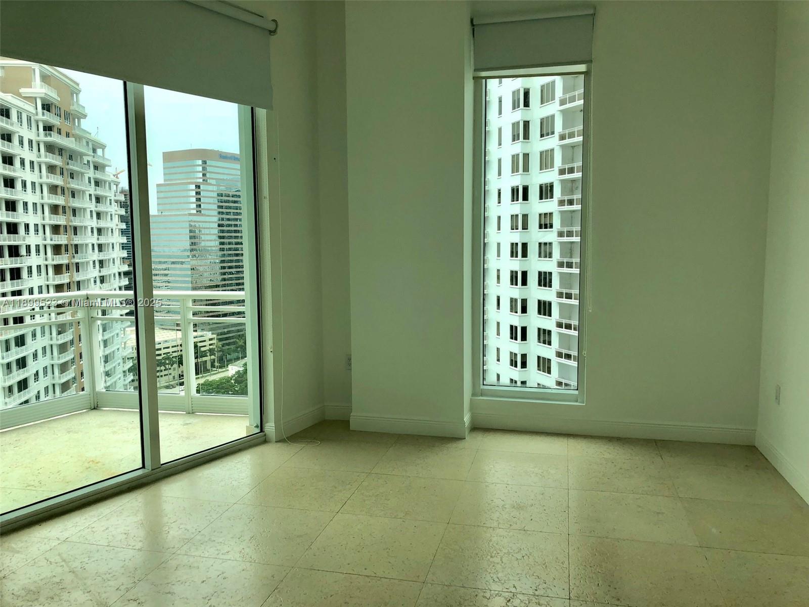 900 Brickell Key Boulevard, Unit 2205 Miami, FL 33131 - Photo 32 of 50 a view of an empty room with a large window