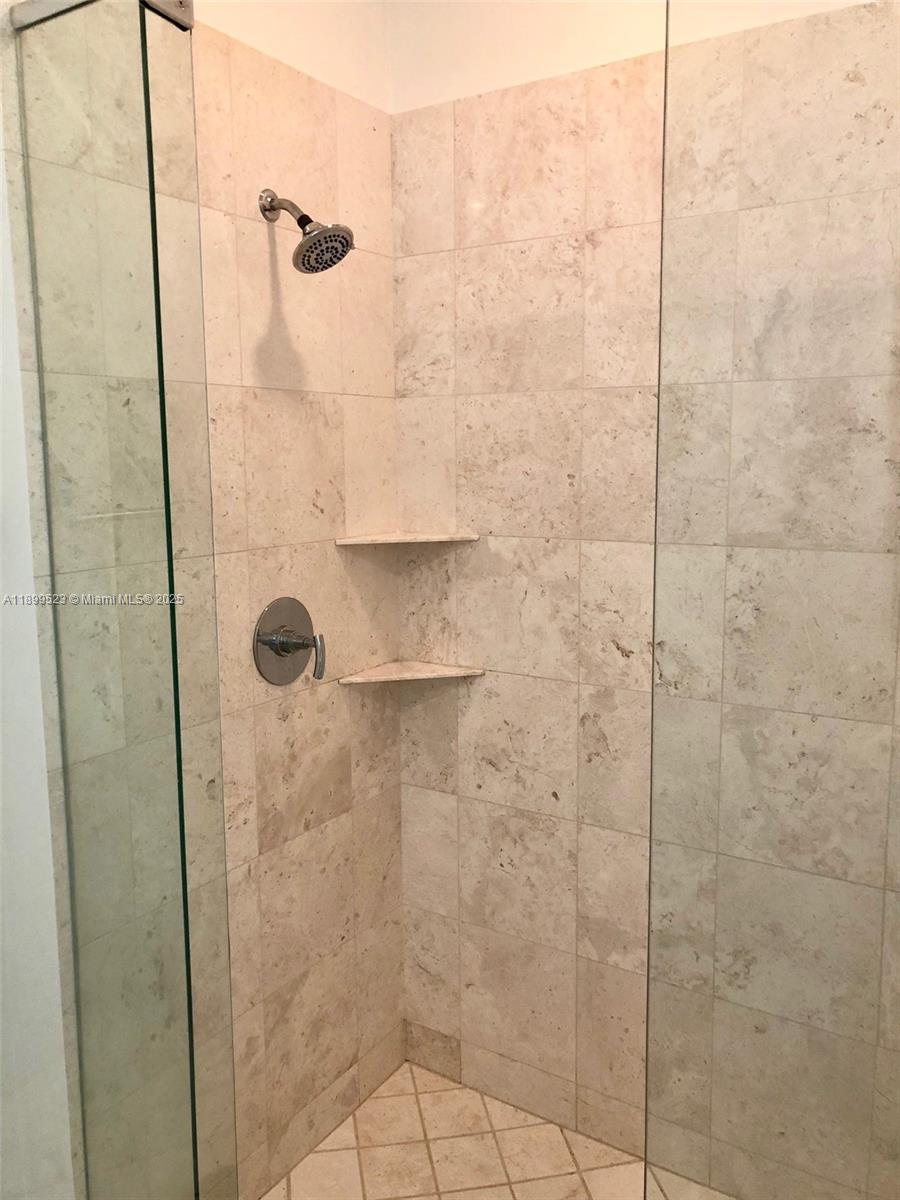 900 Brickell Key Boulevard, Unit 2205 Miami, FL 33131 - Photo 35 of 50 a bathroom with a shower