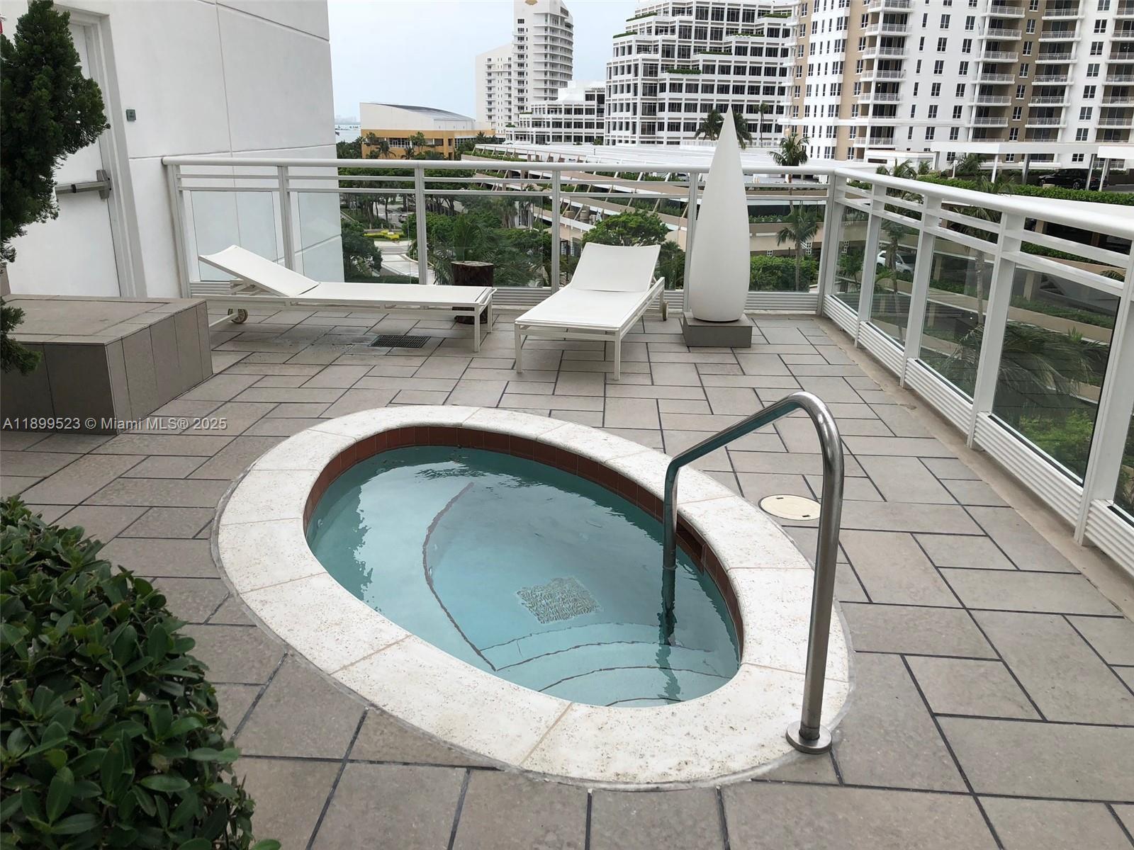 900 Brickell Key Boulevard, Unit 2205 Miami, FL 33131 - Photo 40 of 50 a view of roof deck with seating space