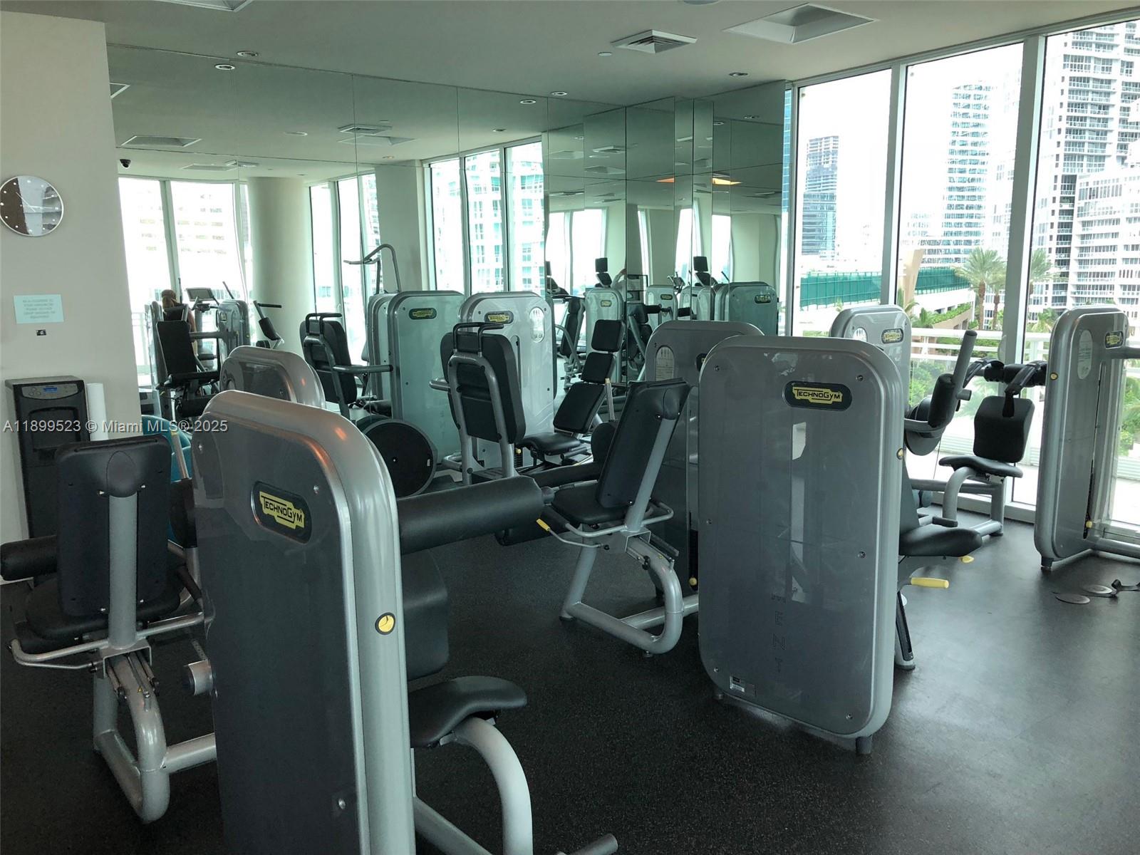 900 Brickell Key Boulevard, Unit 2205 Miami, FL 33131 - Photo 41 of 50 a view of a room with gym equipment