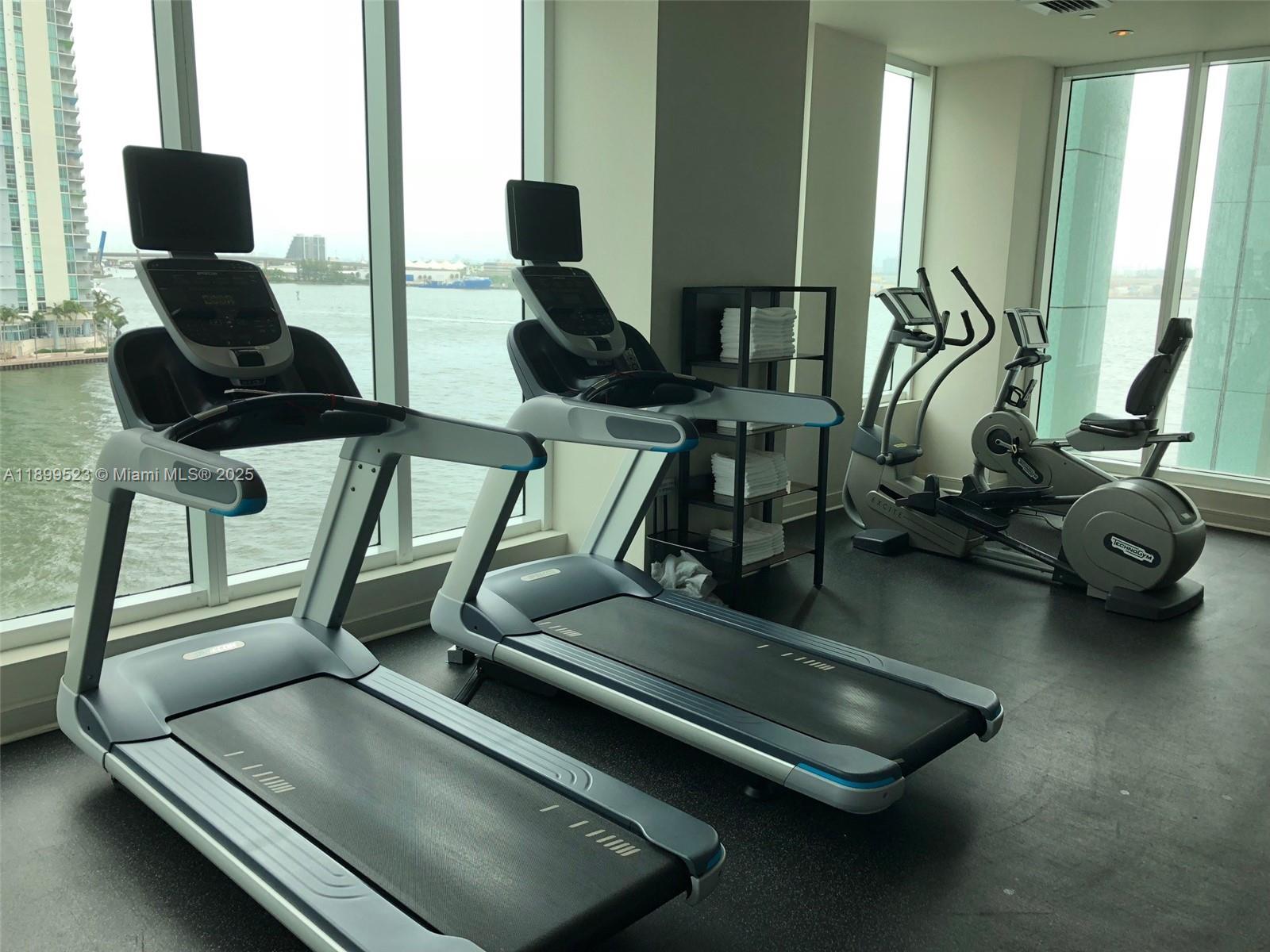 900 Brickell Key Boulevard, Unit 2205 Miami, FL 33131 - Photo 42 of 50 a room with gym equipment