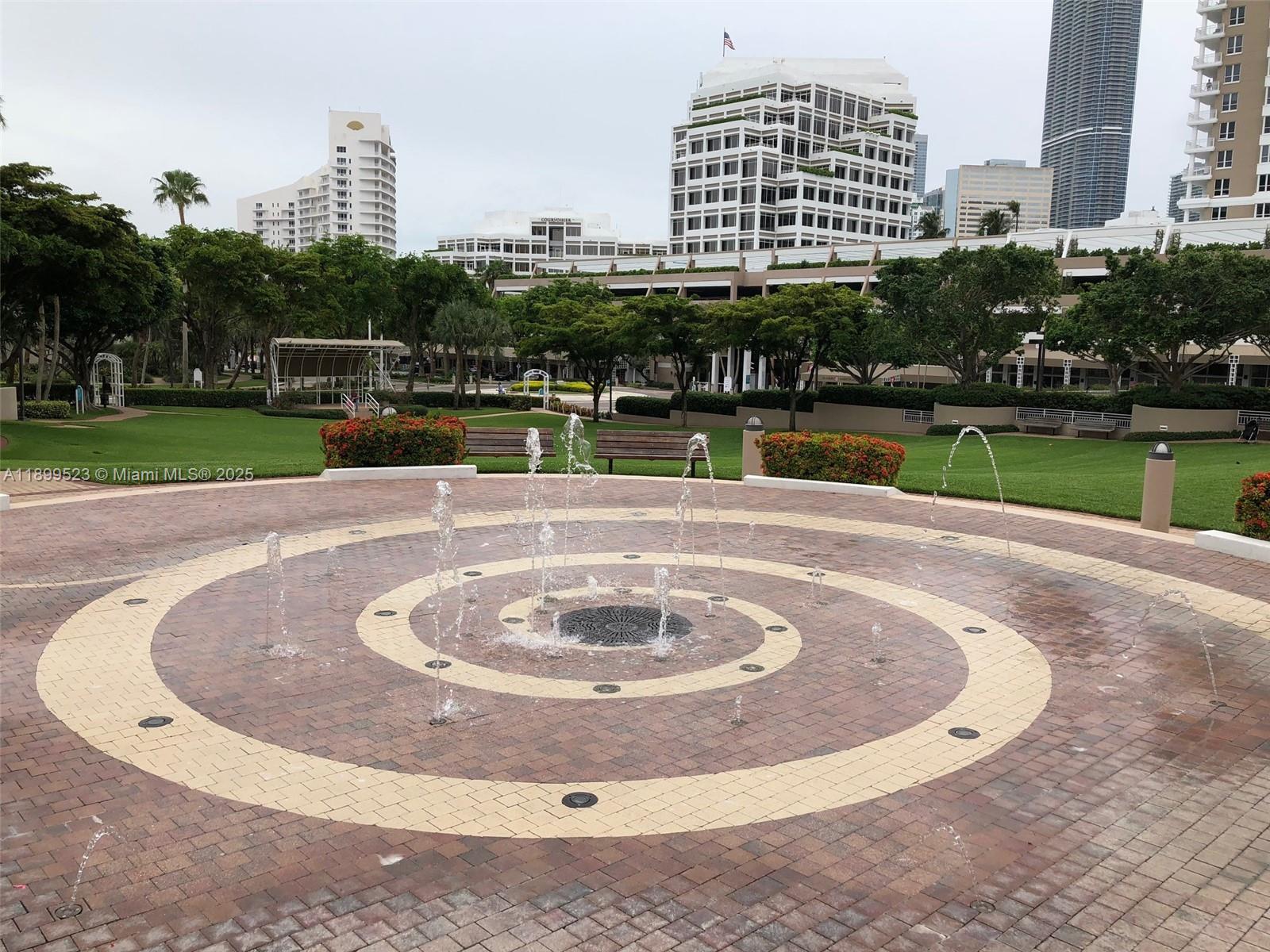 900 Brickell Key Boulevard, Unit 2205 Miami, FL 33131 - Photo 49 of 50 a view of a swimming pool with a yard