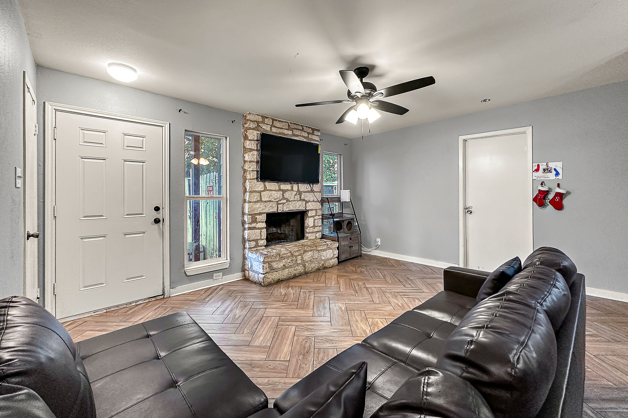 700 Misty Morning Way Round Rock, TX 78664 - Photo 21 of 36 Unit A - A corner fireplace crafted from natural stone anchors this welcoming living area.