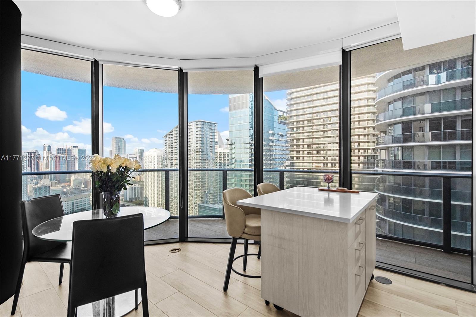 55 Southwest 9th Street, Unit 3601 Miami, FL 33130 - Photo 21 of 38 a view of a dining room with furniture window and outside view