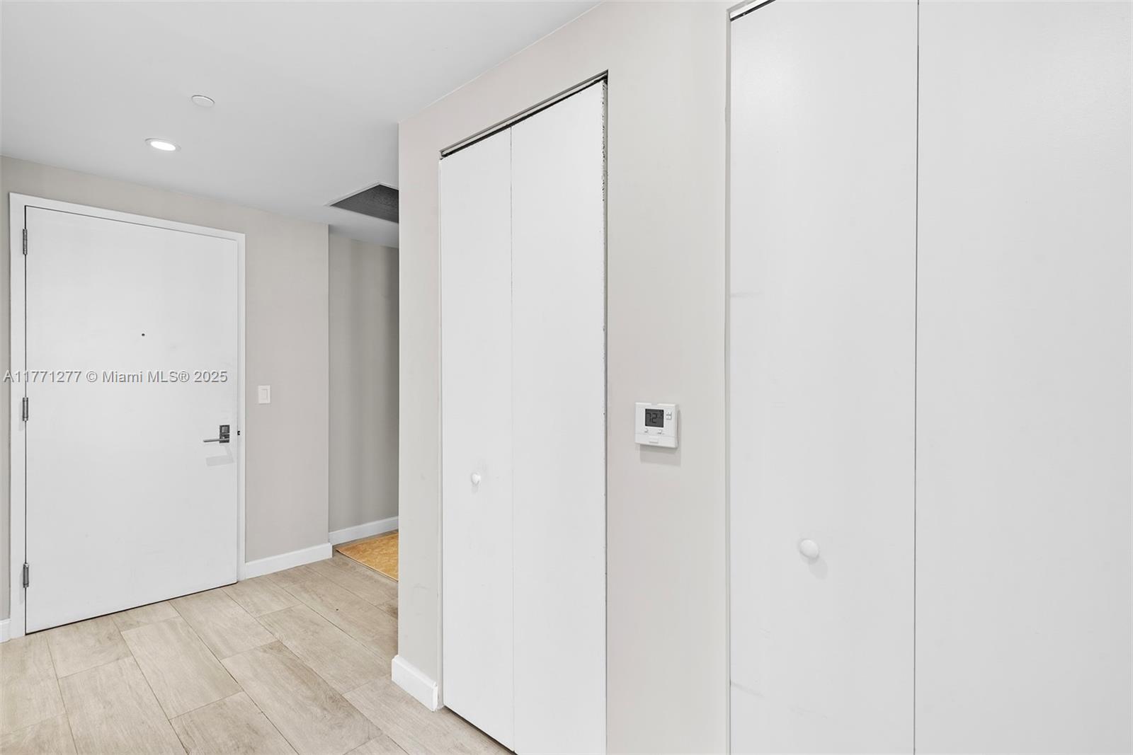 55 Southwest 9th Street, Unit 3601 Miami, FL 33130 - Photo 22 of 38 a view of hallway with wooden floor
