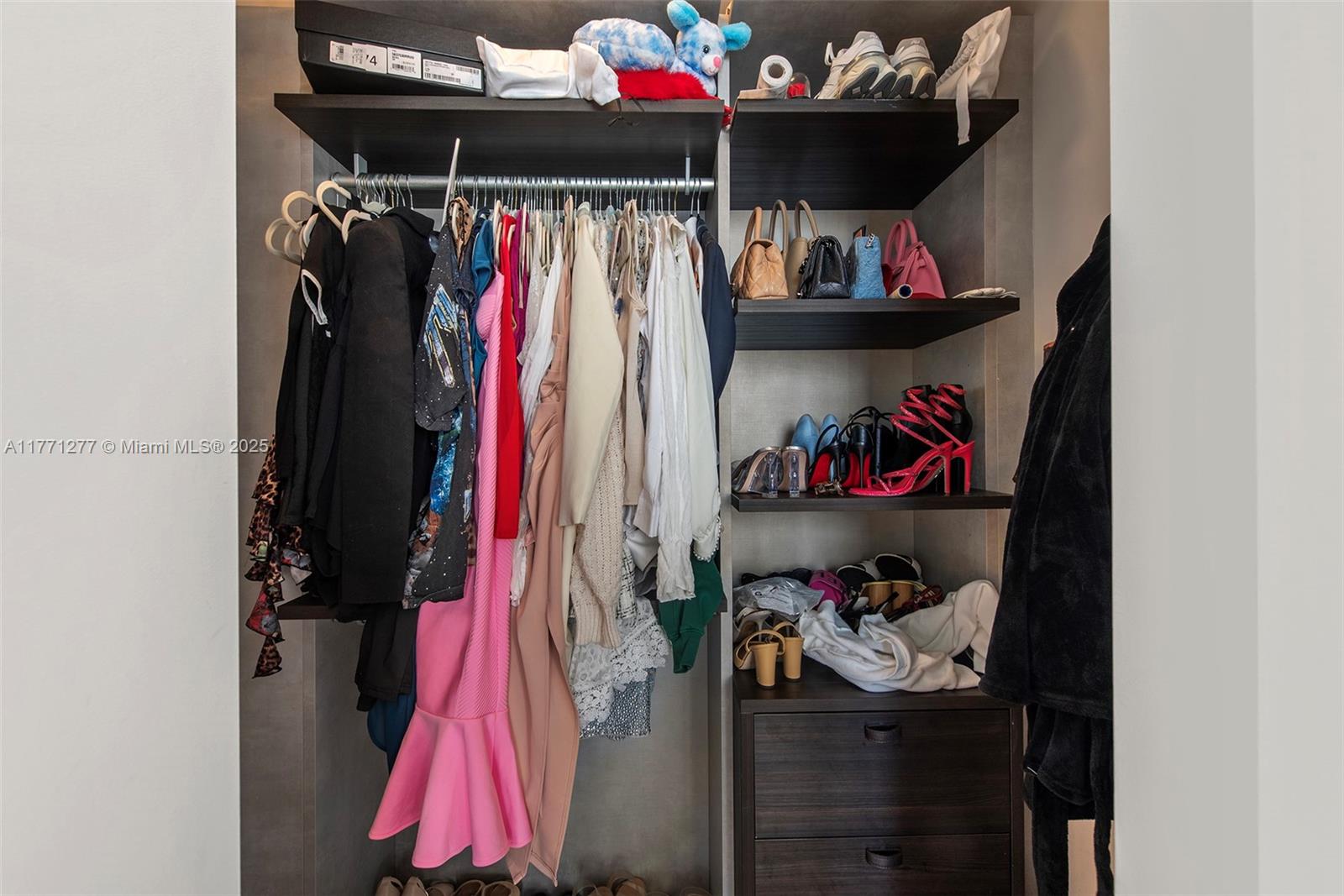 55 Southwest 9th Street, Unit 3601 Miami, FL 33130 - Photo 27 of 38 a view of a closet with storage