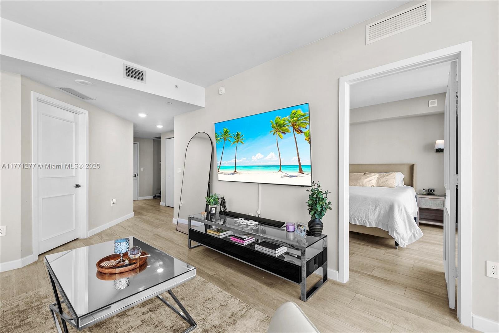 55 Southwest 9th Street, Unit 3601 Miami, FL 33130 - Photo 3 of 38 a living room with furniture and a table