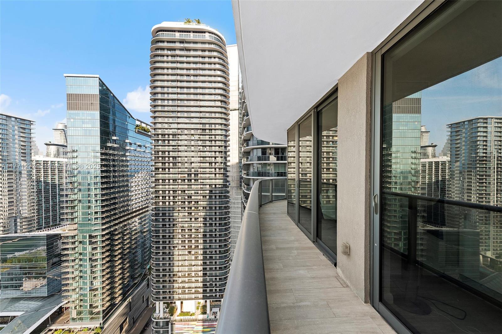 55 Southwest 9th Street, Unit 3601 Miami, FL 33130 - Photo 33 of 38 a view of balcony with wooden floor and city view