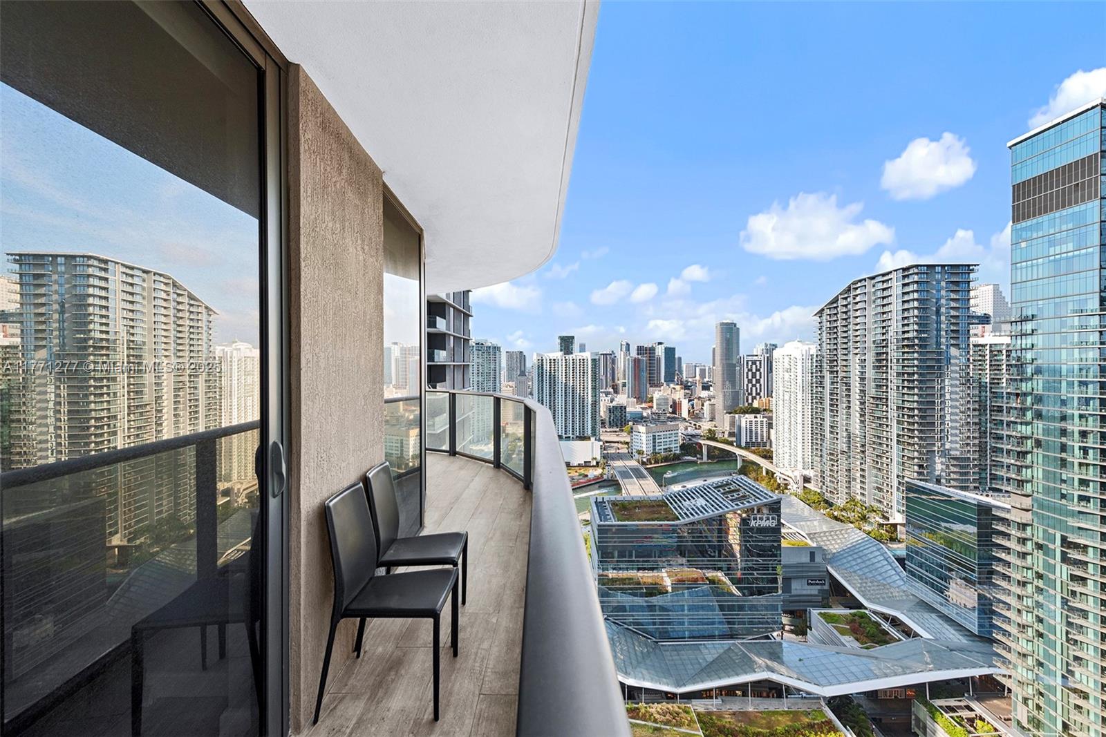 55 Southwest 9th Street, Unit 3601 Miami, FL 33130 - Photo 38 of 38 a view of a balcony with chairs