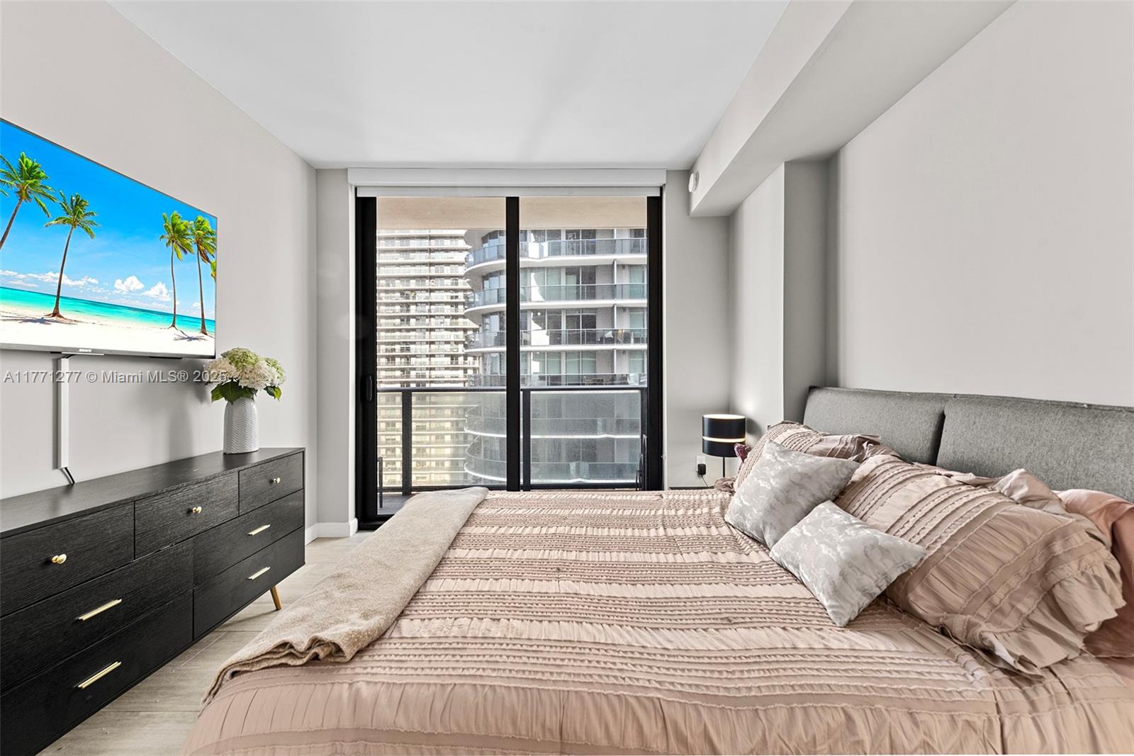 55 Southwest 9th Street, Unit 3601 Miami, FL 33130 - Photo 9 of 38 a bedroom with a bed and a window