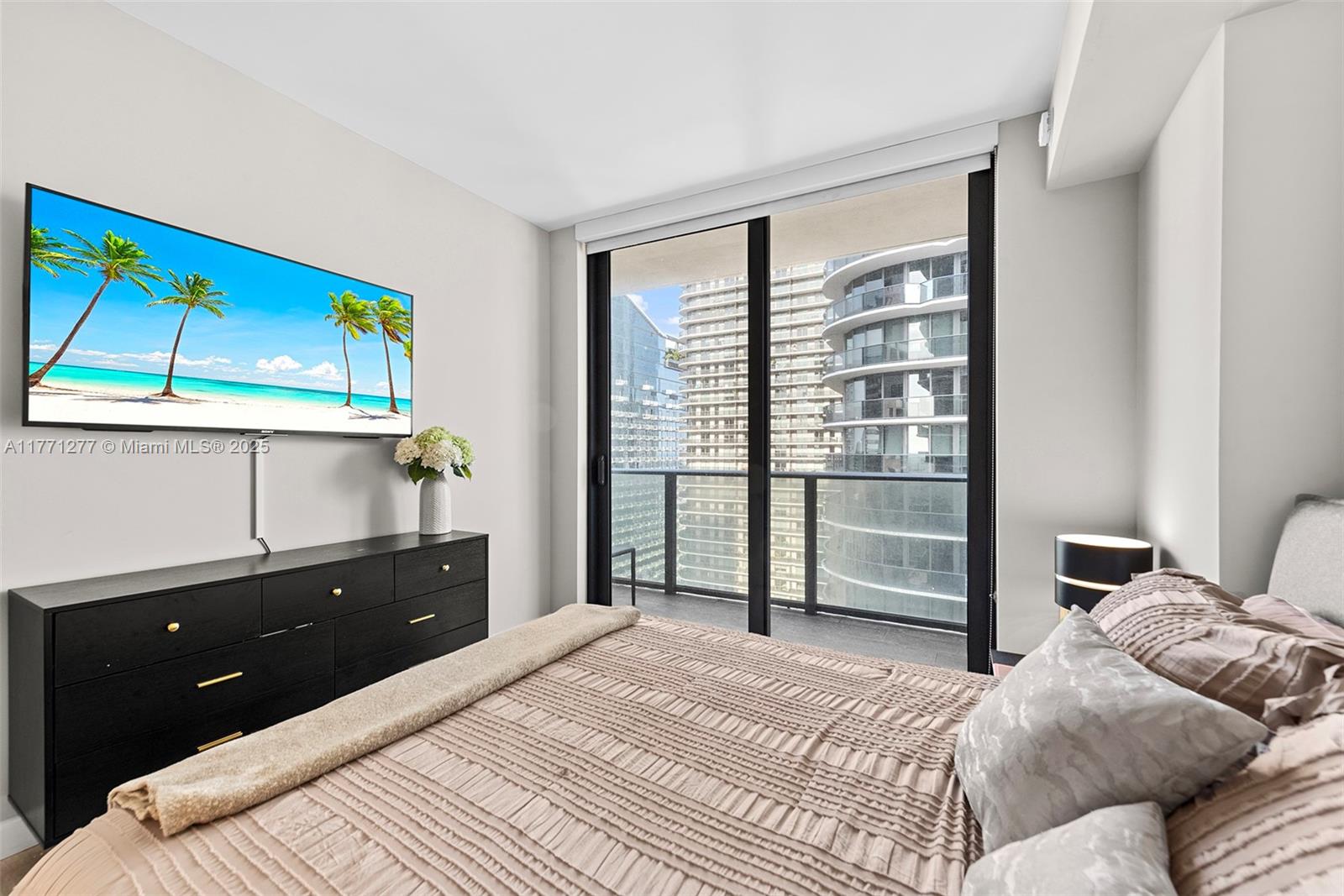 55 Southwest 9th Street, Unit 3601 Miami, FL 33130 - Photo 10 of 38 a bedroom with a bed and a window