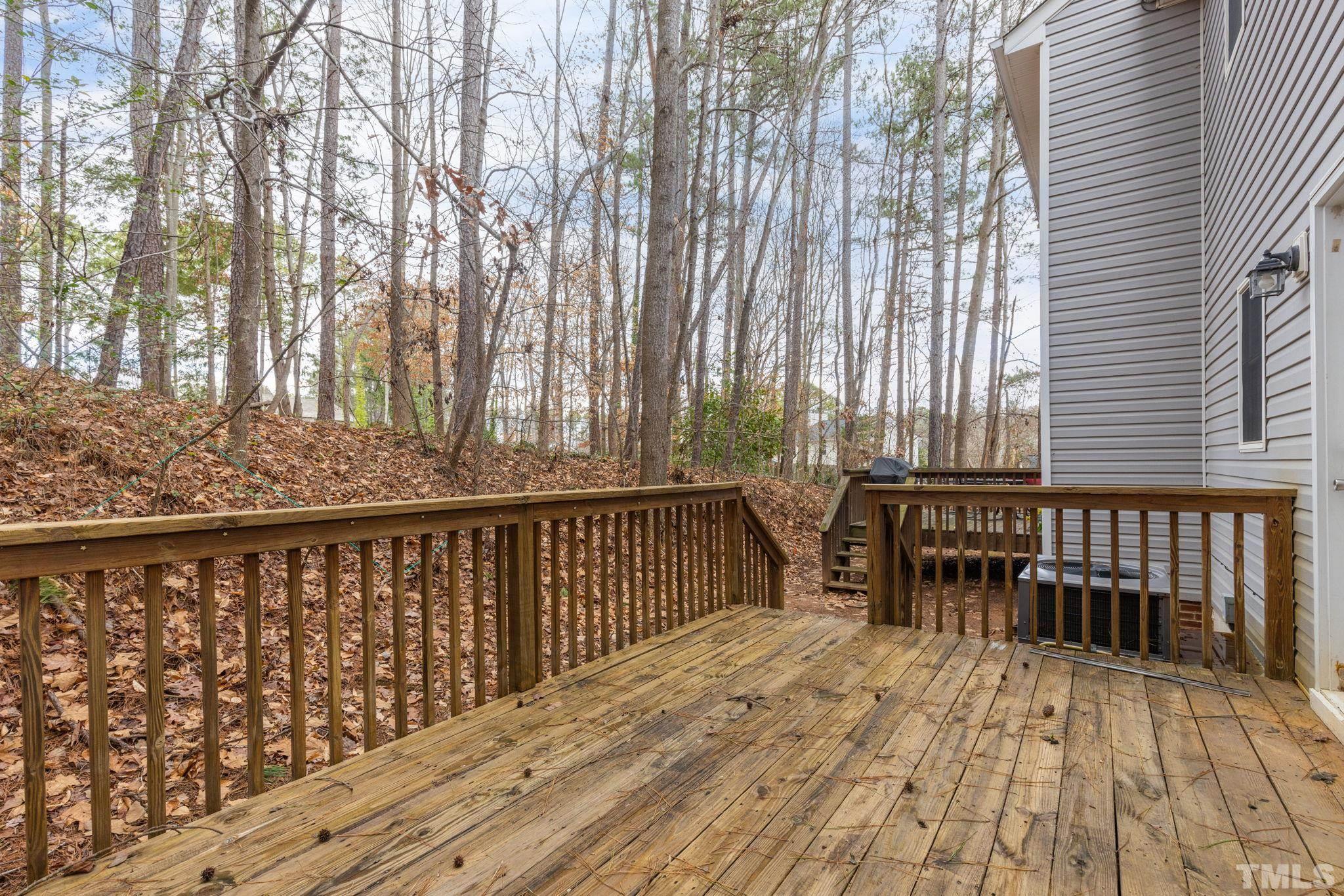 4313 Timberwood Drive Raleigh, NC 27612 - Photo 12 of 28 a view of balcony with wooden floor and fence
