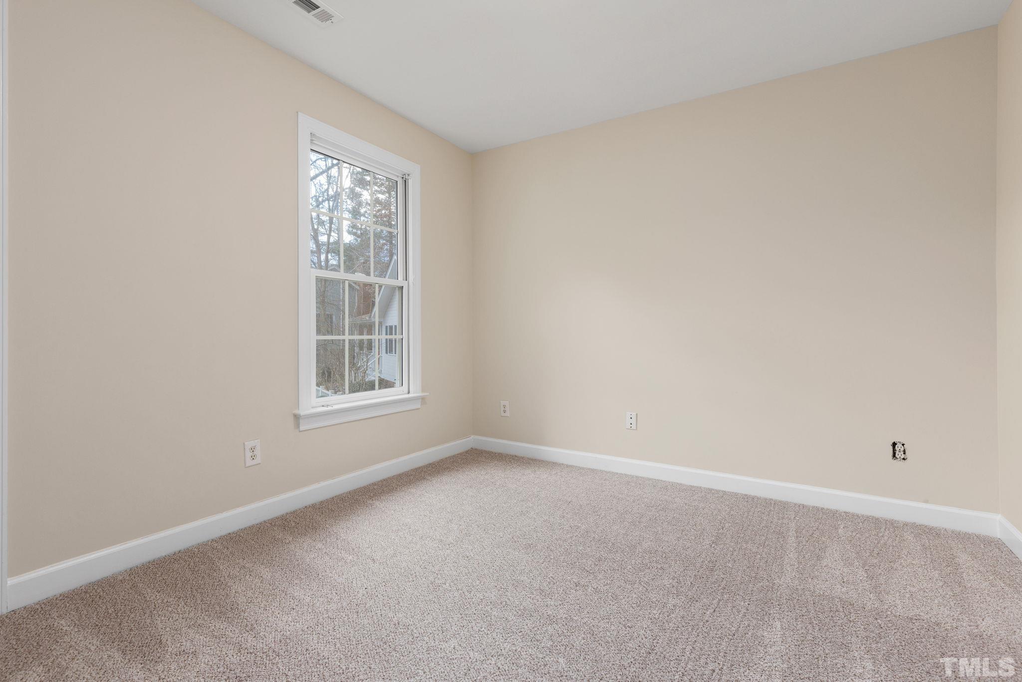4313 Timberwood Drive Raleigh, NC 27612 - Photo 23 of 28 a view of an empty room with a window
