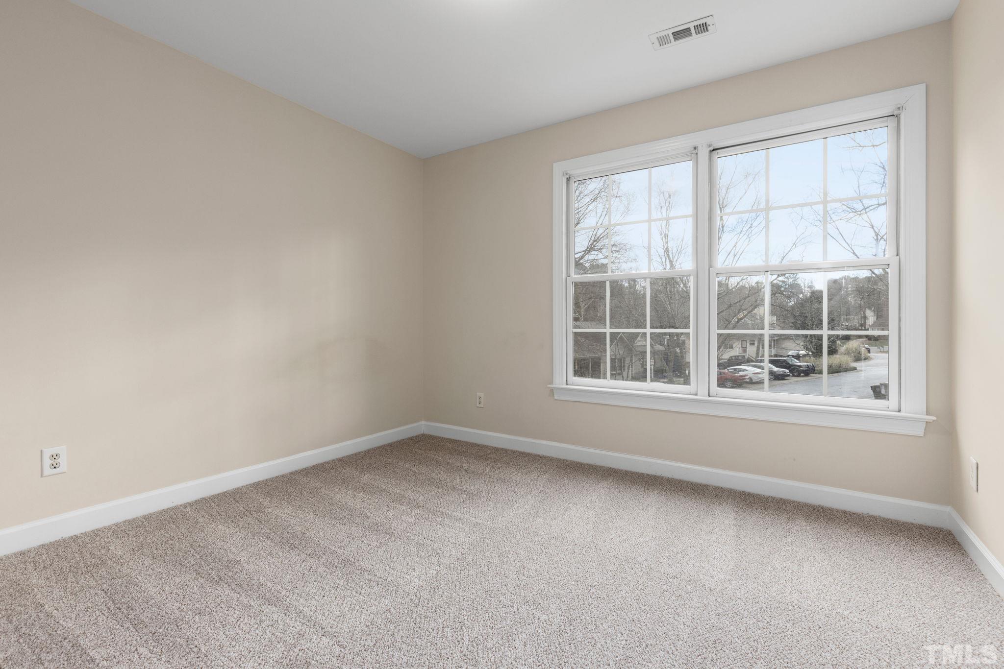 4313 Timberwood Drive Raleigh, NC 27612 - Photo 26 of 28 an empty room with a window