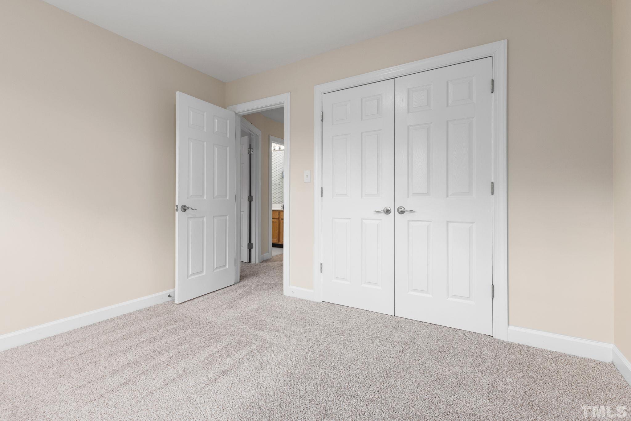 4313 Timberwood Drive Raleigh, NC 27612 - Photo 27 of 28 an empty room with closet area