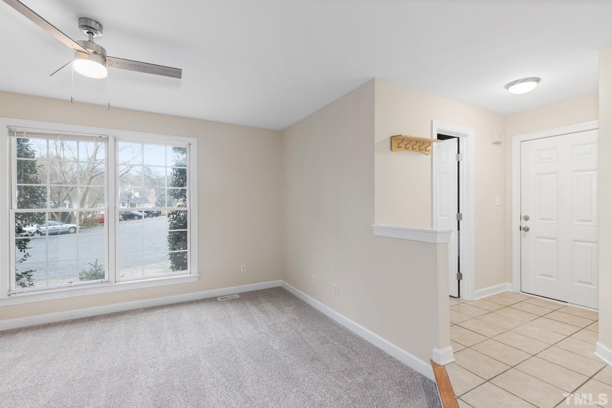 4313 Timberwood Drive Raleigh, NC 27612 - Photo 4 of 28 a view of an empty room with a window