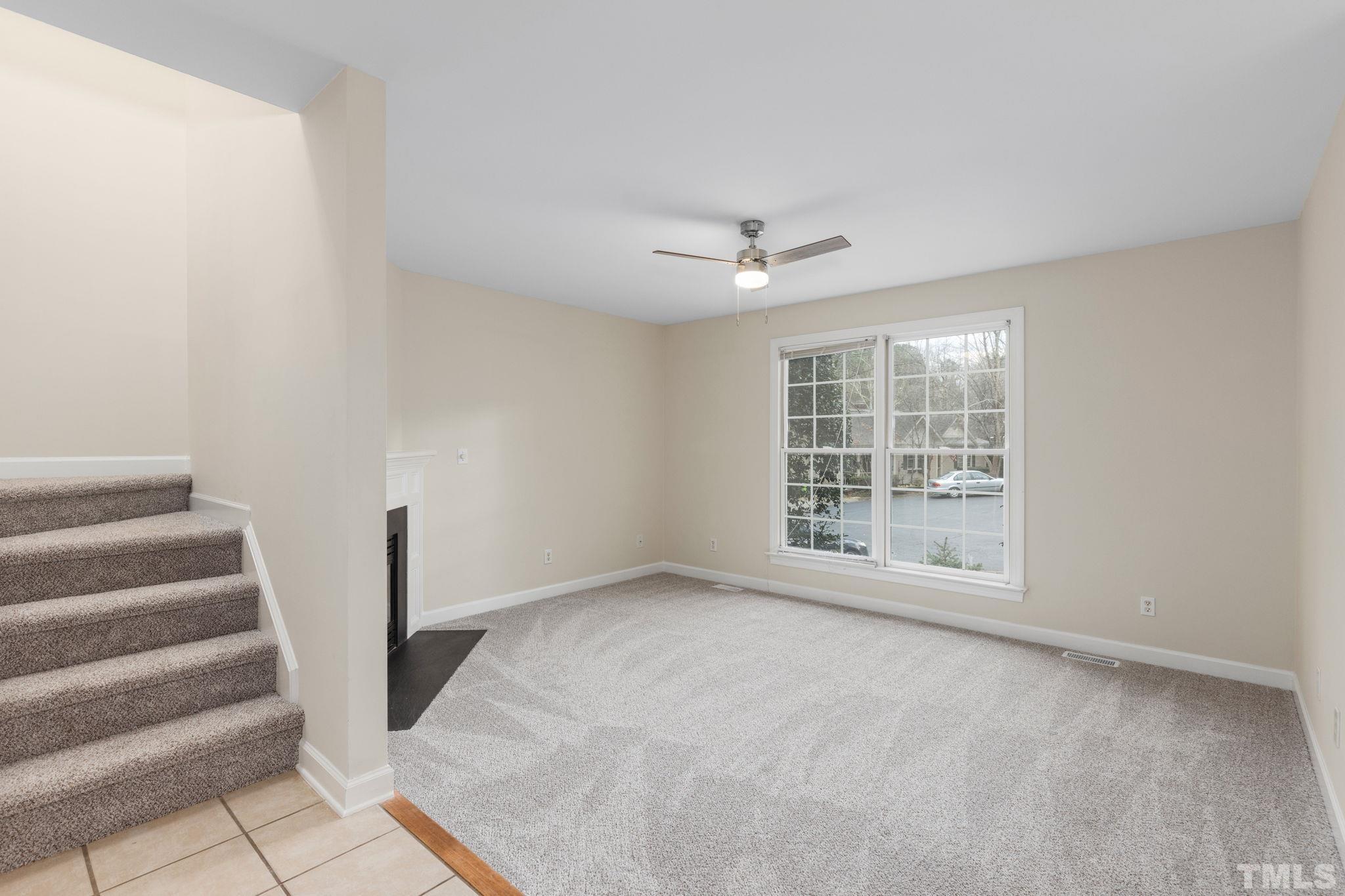 4313 Timberwood Drive Raleigh, NC 27612 - Photo 5 of 28 a view of an empty room with a window