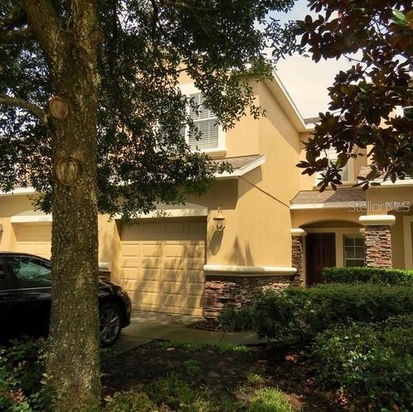 11823 Castine Street New Port Richey, FL 34654 - Photo 1 of 1 a front view of a house with garden