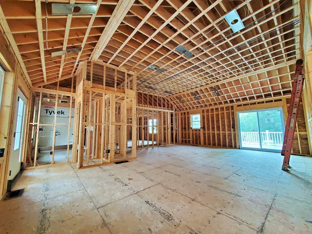 527 High Street Rochester, MA 02770 - Photo 2 of 6 an empty room with wooden floor and windows