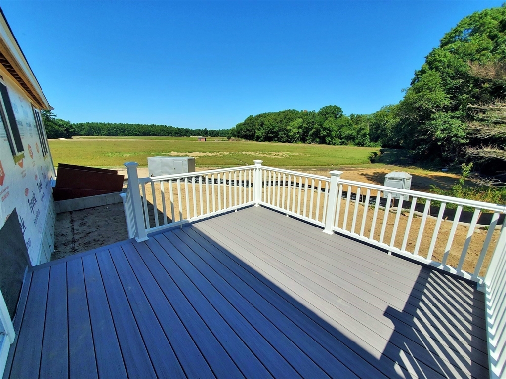 527 High Street Rochester, MA 02770 - Photo 3 of 6 a view of a wooden deck with a yard
